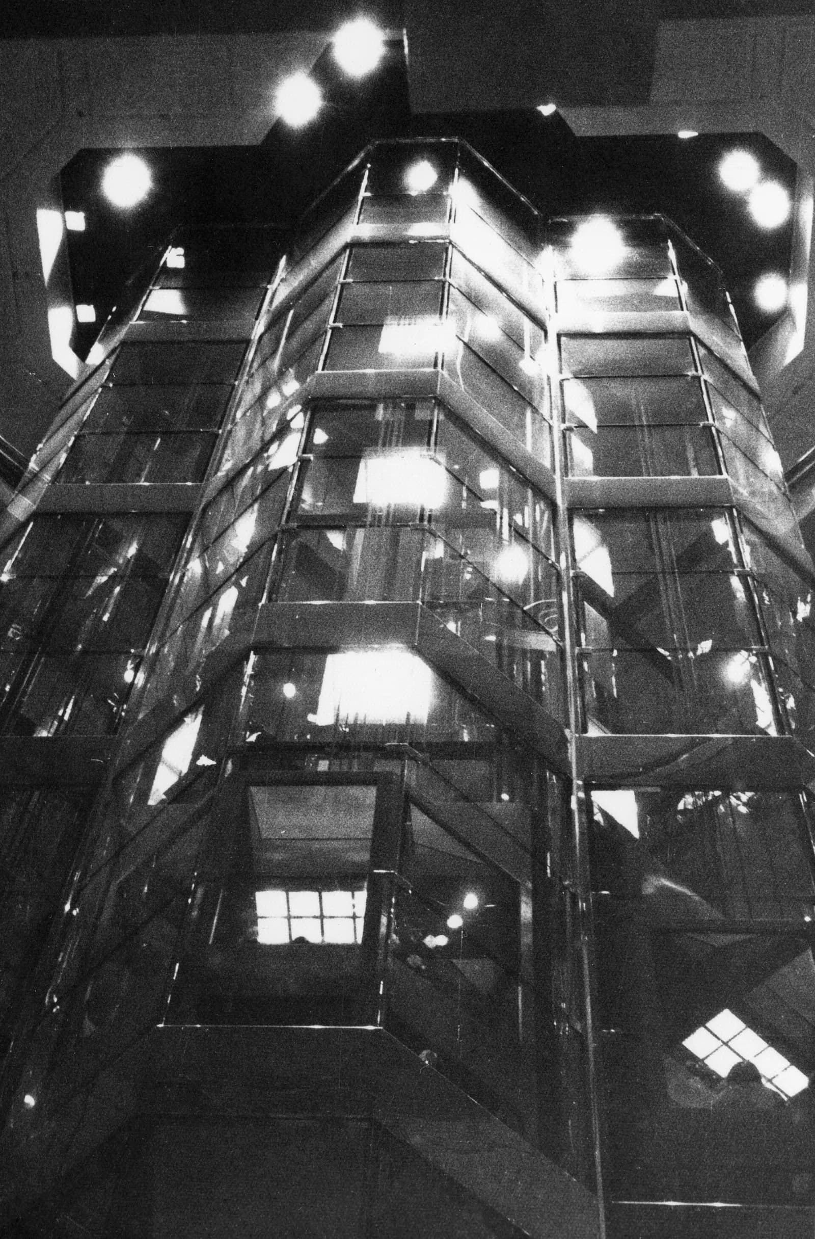 Looking up a glass elevator shaft